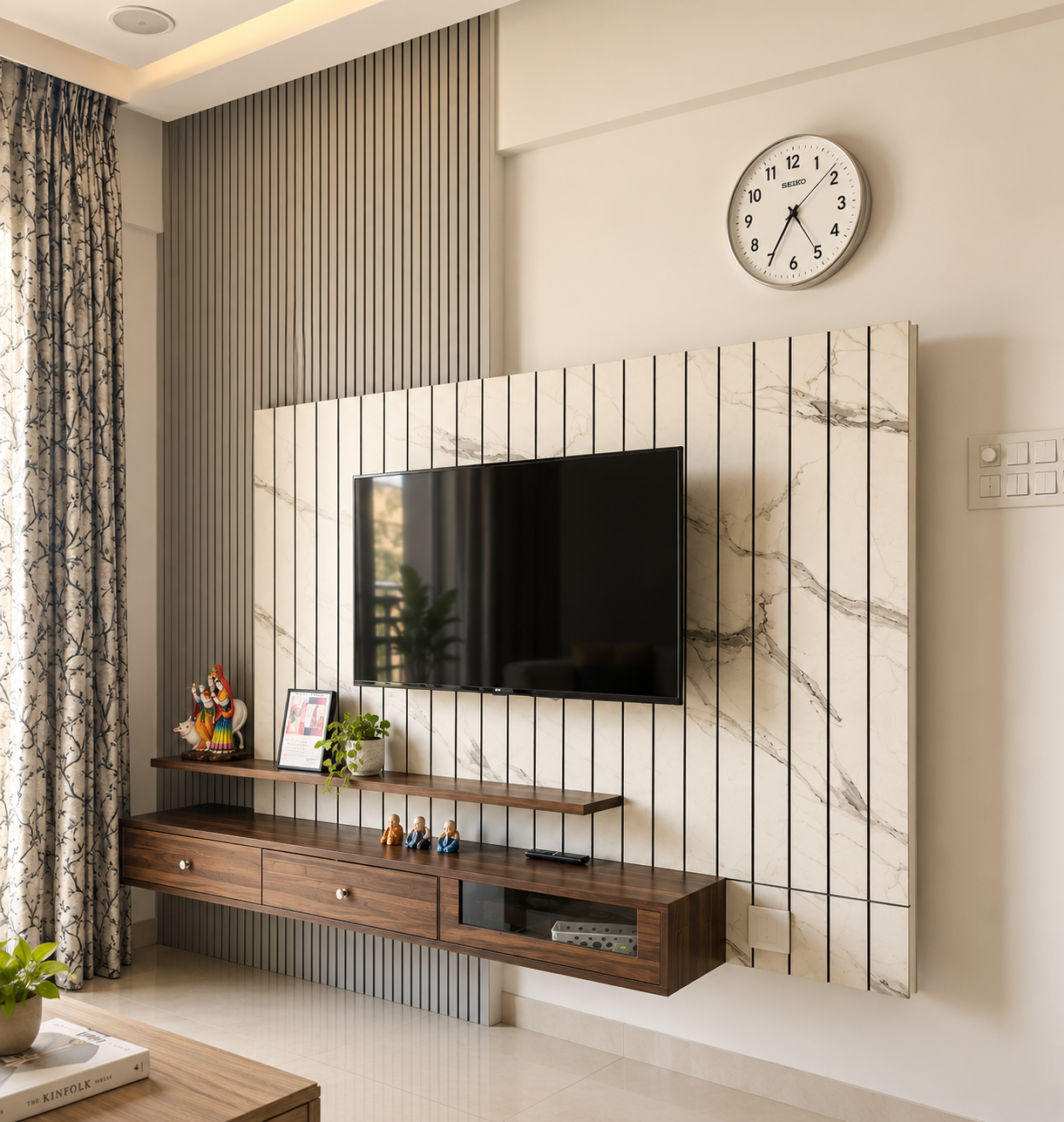 Television wall with marble-look panelling, black grooves, a floating timber shelf and a wall-hung console