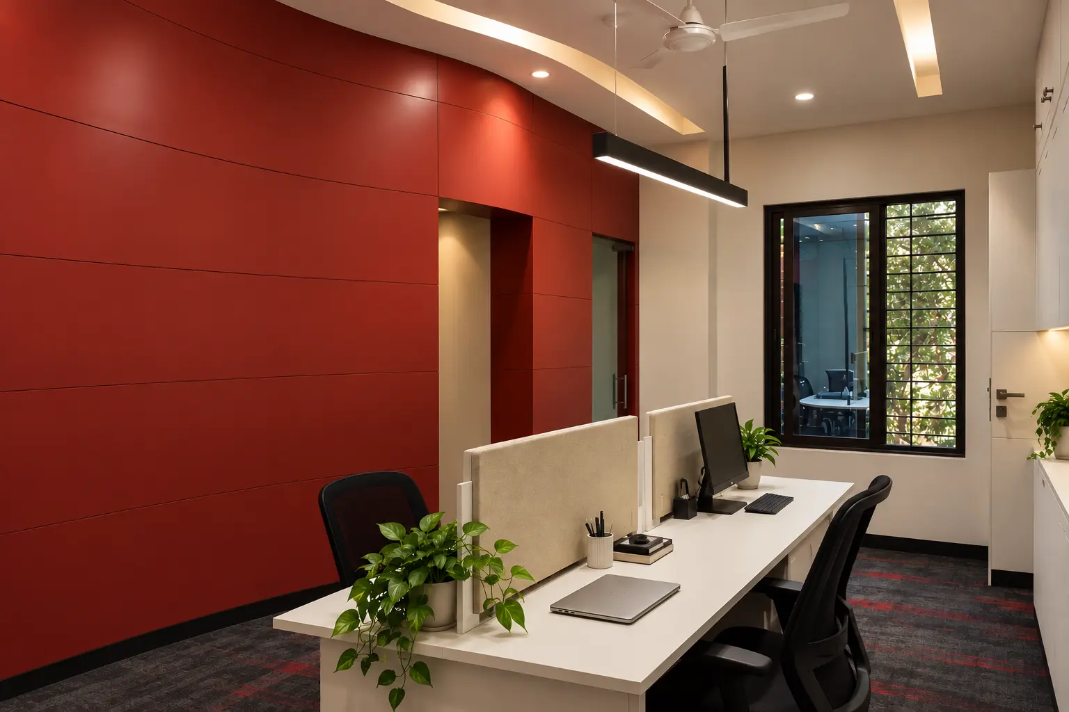 Naturally lit employee workspace planned alongside the red wall